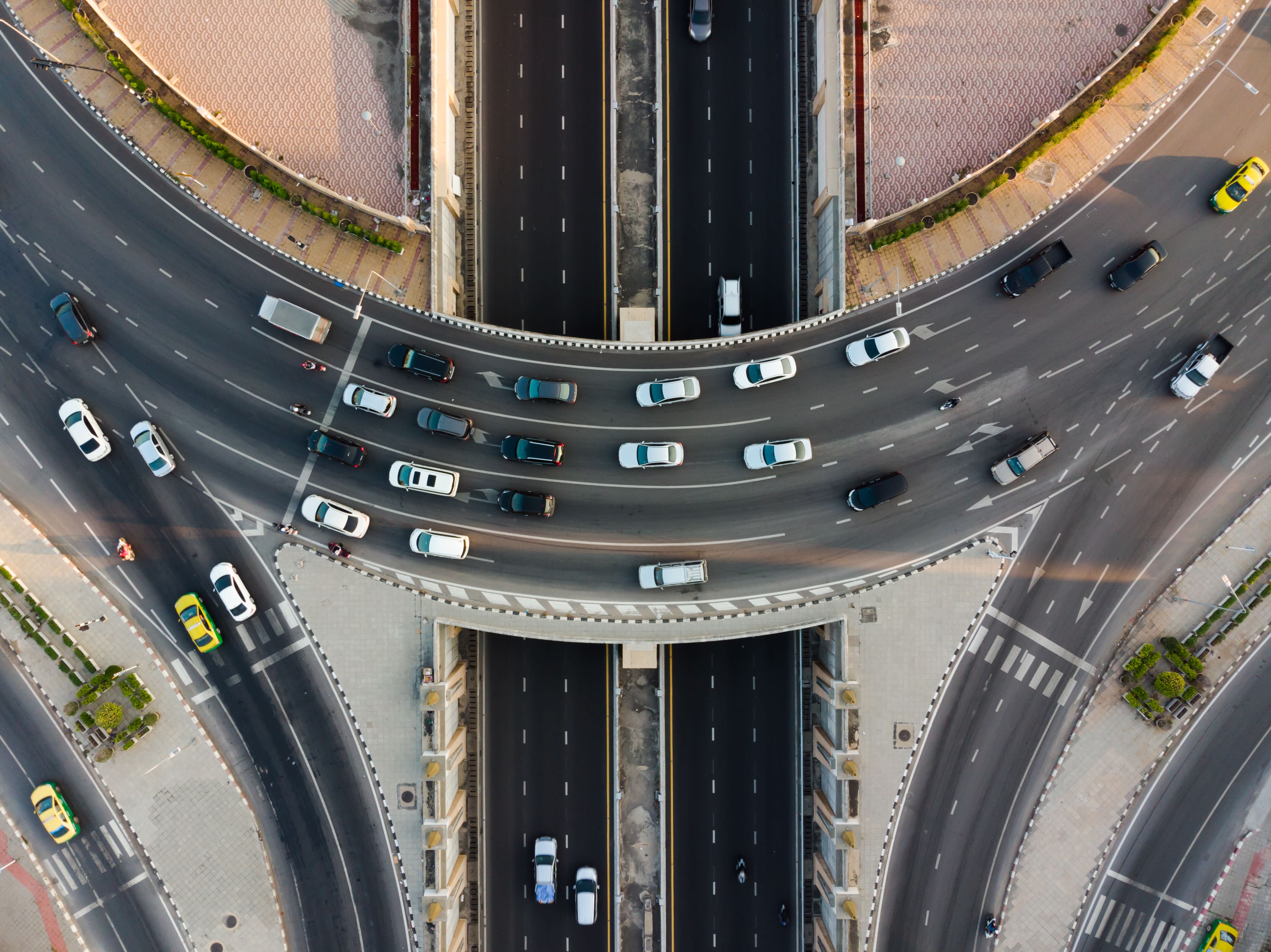 cars driving in busy traffic